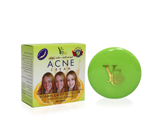 Acne Cream by V6 with special formula, featuring a light green box with three smiling women and a matching round green compact with a gold V6 logo, set against a plain white background.